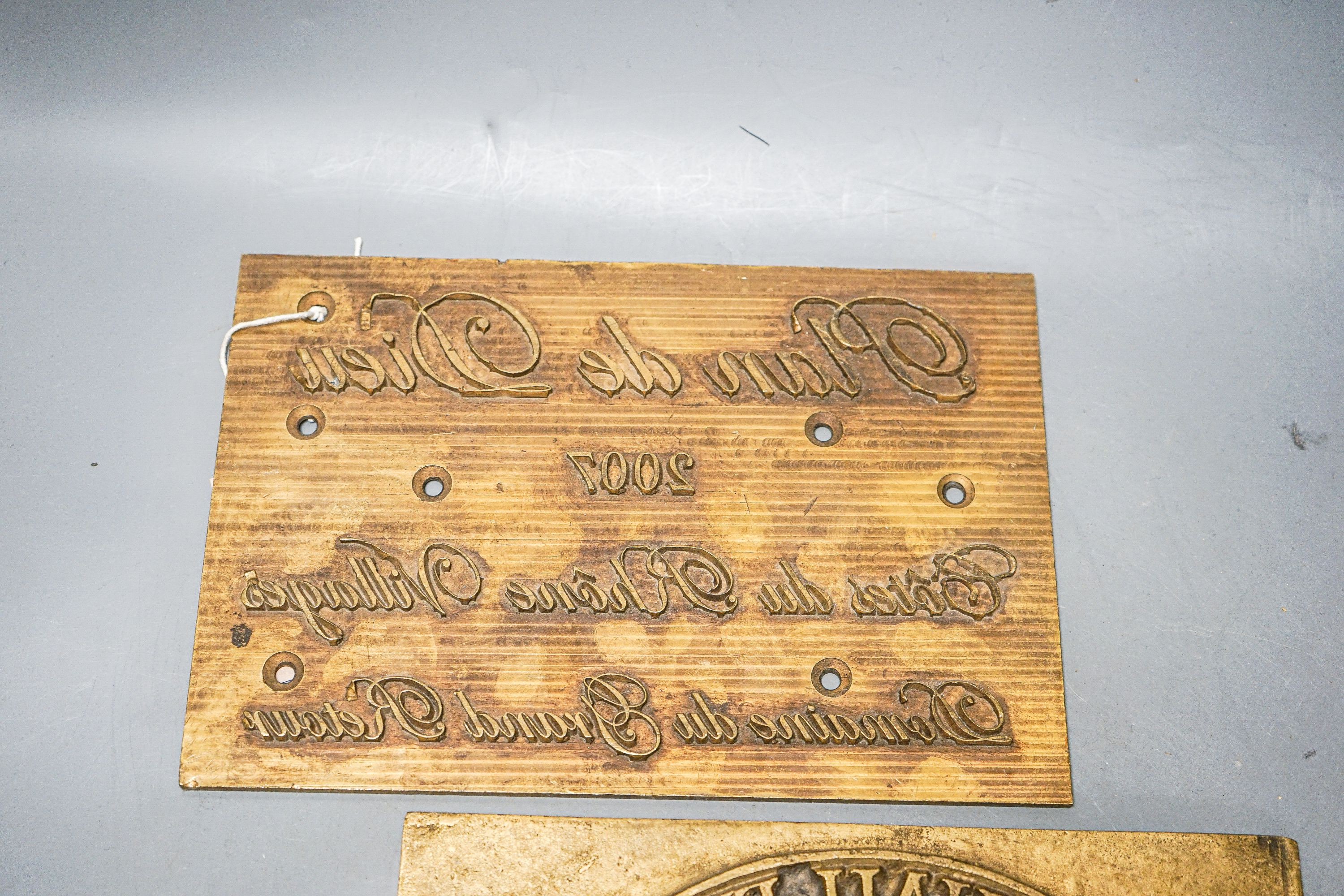 Three wine related brass printing plates